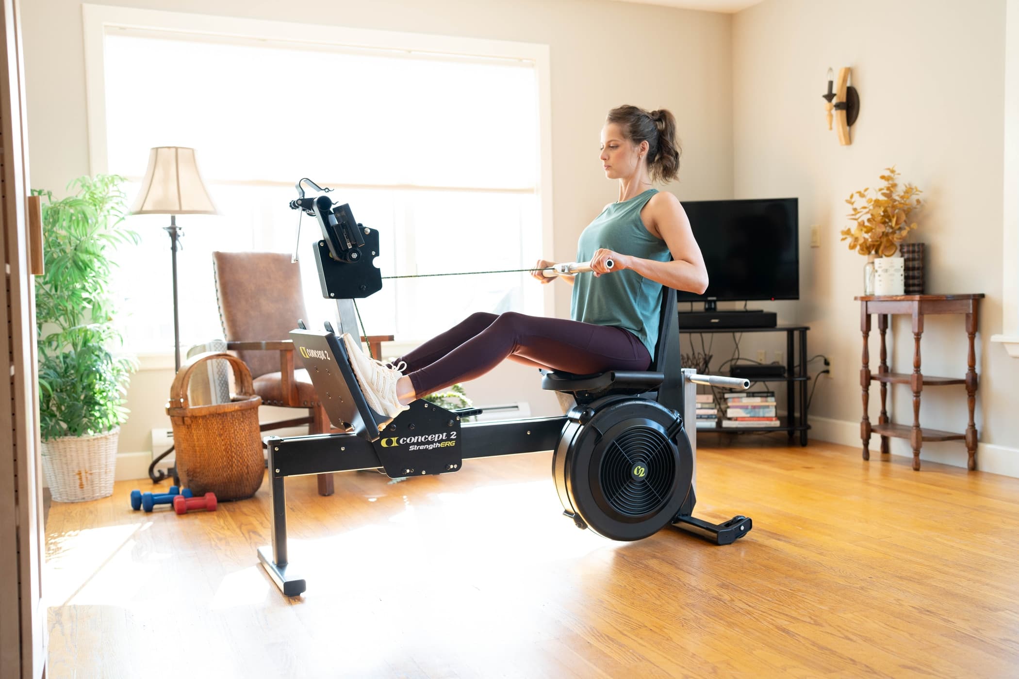 Women doing a seated row on the StrengthErg